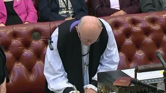 After swearing the Oath, the Bishop of Rochester signs the Roll and the Code of Conduct