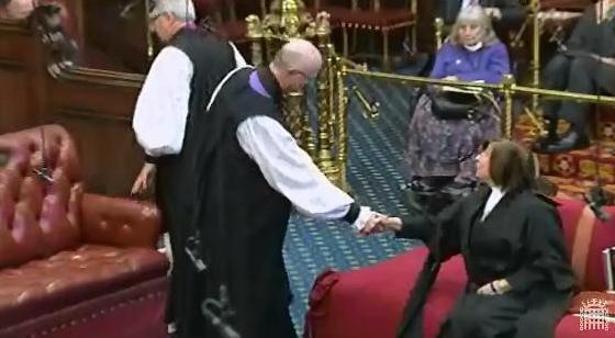 The Bishop of Rochester shakes hands with the Lord Speaker before taking his seat on the Bishops' Benches
