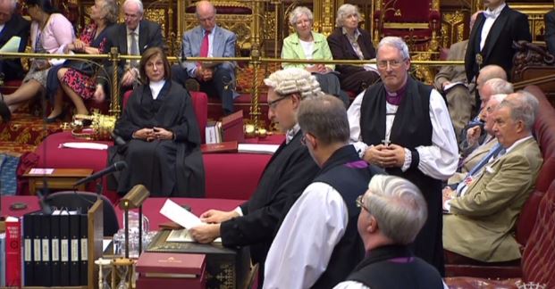 The Reading Clerk reads the Writ of Summons to the House, whilst the Bishop of Oxford stands with his two sponsors, the Bishops of Southwark and Norwich