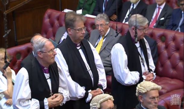 After signing the test roll and the code of conduct, the Bishop of Oxford and his sponsors bow to the Throne